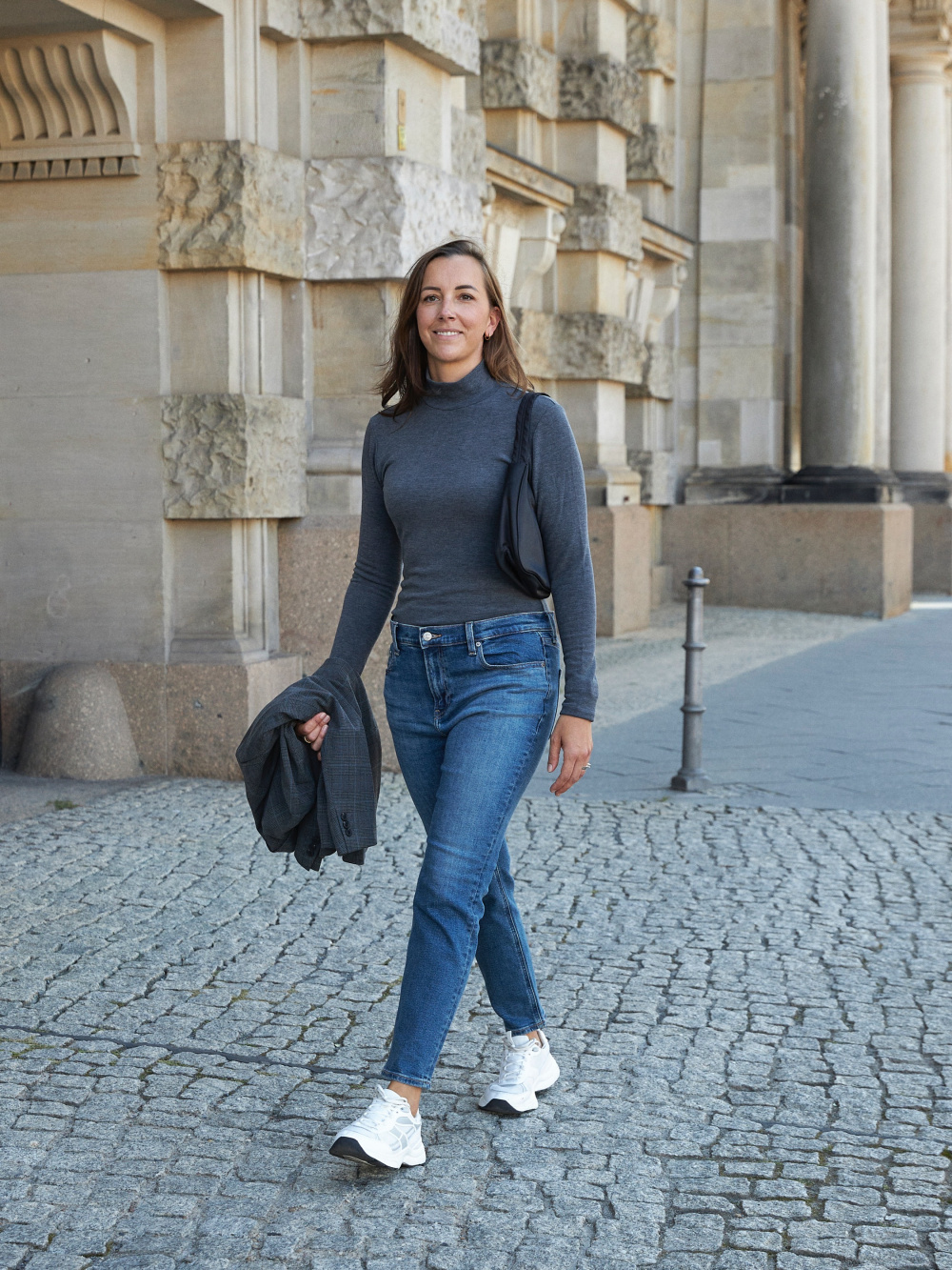 Premium Photo  Lady in long sleeve top. sandals and blue denim