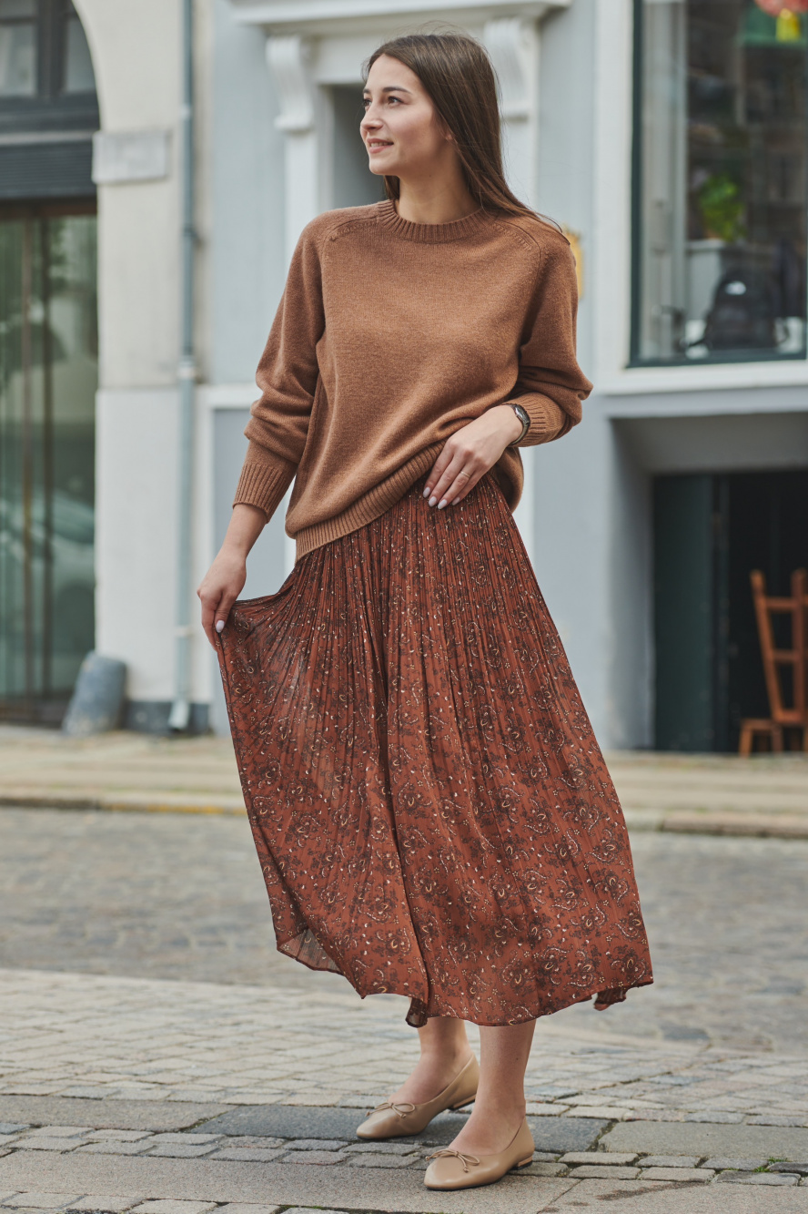 Pleated skirt and ankle clearance boots