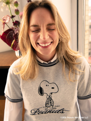 styling PEANUTS gray t-shirt with striped neckline and sleeves. Preppy Snoopy in middle of shirt design