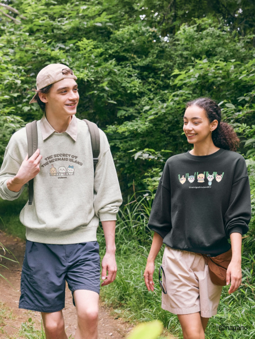 styling chiikawa sweatshirts on men and women on a light hike