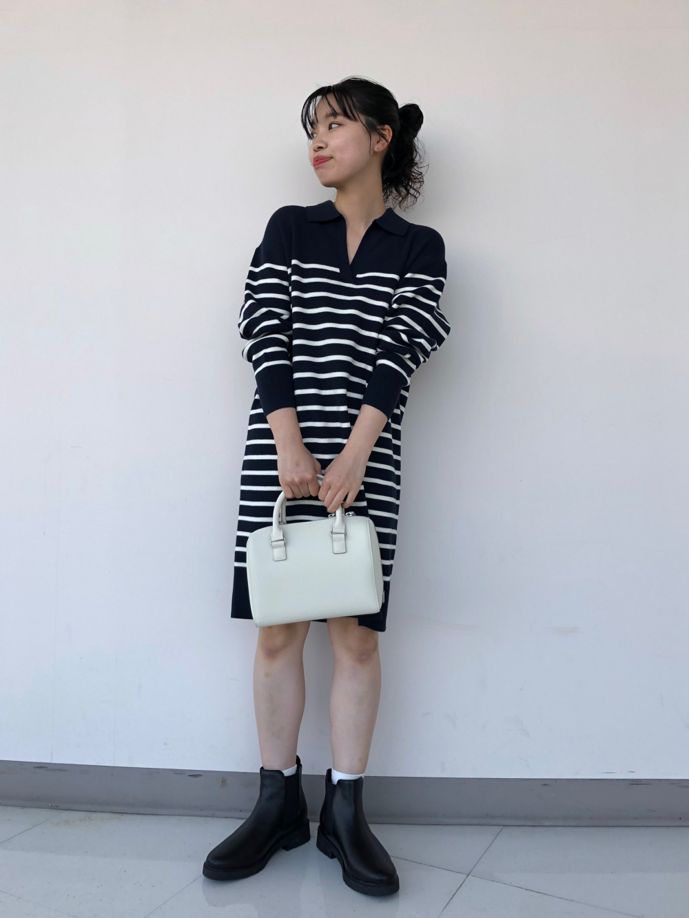 ブロックテックコート、ウルトラライトダウンロングベスト」の着用